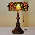 10-inch Tiffany stained glass table lamp with multicoloured glass and resin base on desk
