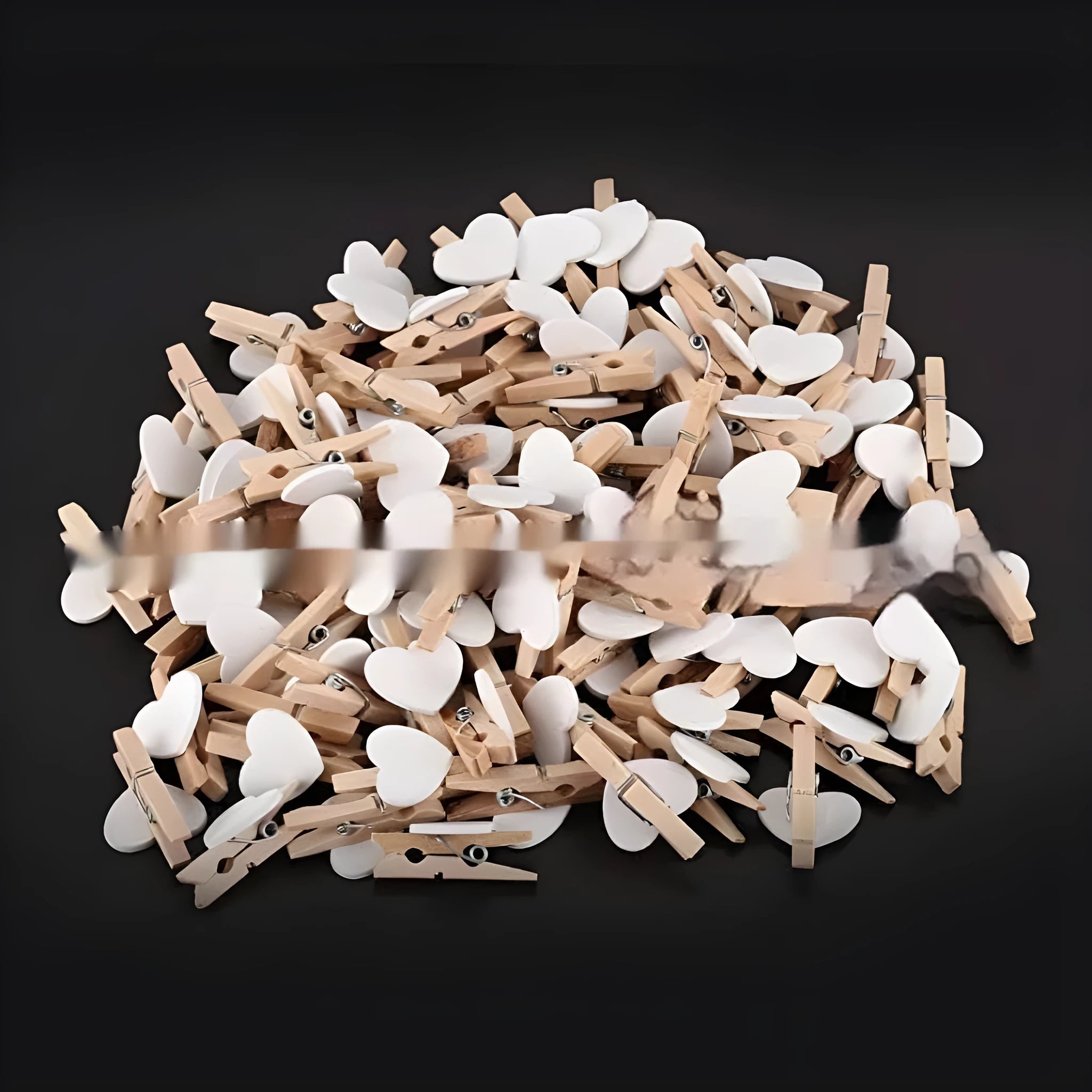 Five handmade solid wood heart-shaped hair clips in red, white, and pink on a wooden surface.