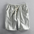 Men's striped cotton casual shorts with elastic waistband in light blue colour showing straight leg cut