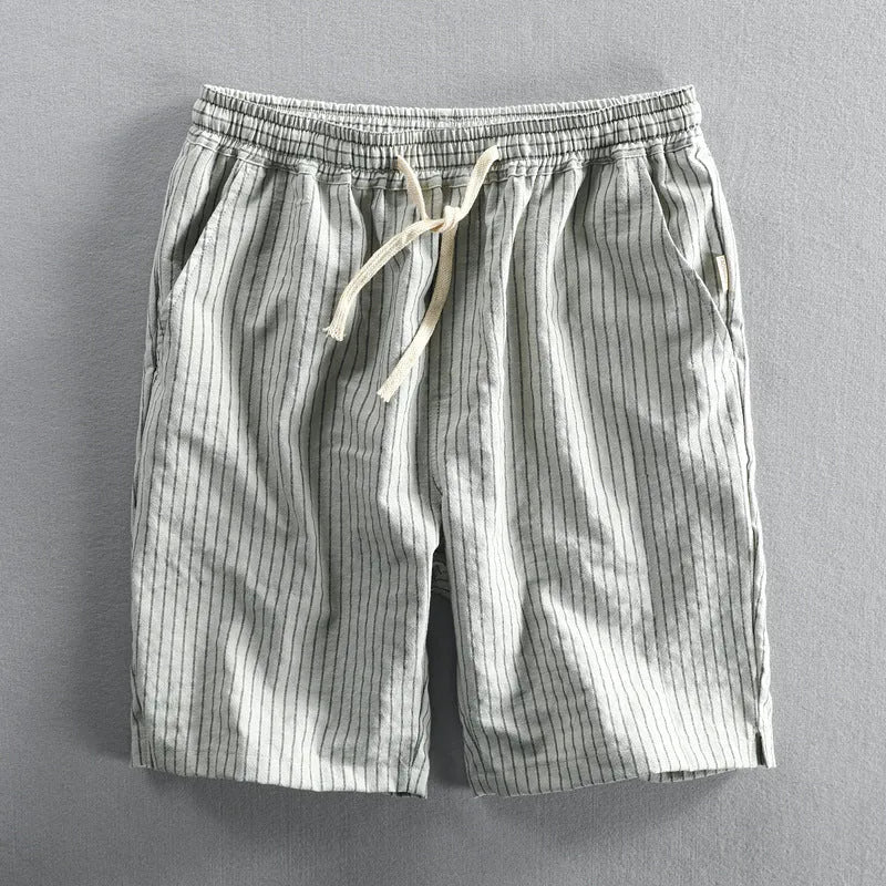 Men's striped cotton casual shorts with elastic waistband in light blue colour showing straight leg cut