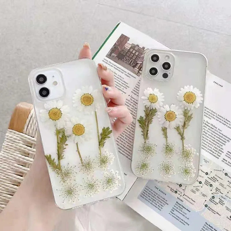 White TPU iPhone case with a raised epoxy daisy flower design on the back