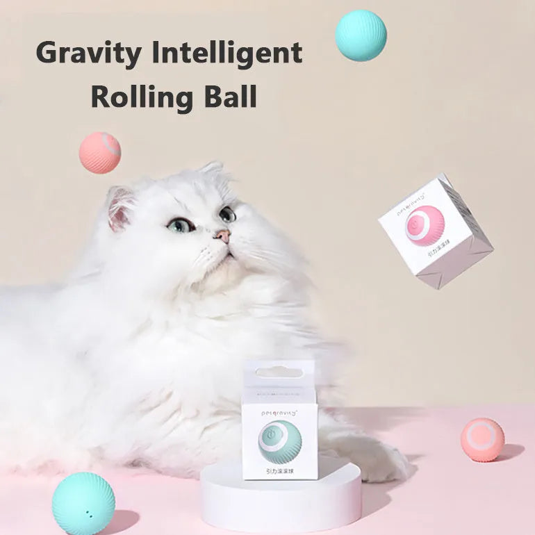 Green or pink 43mm automatic rolling ball cat toy with intelligent obstacle avoidance on a hard floor