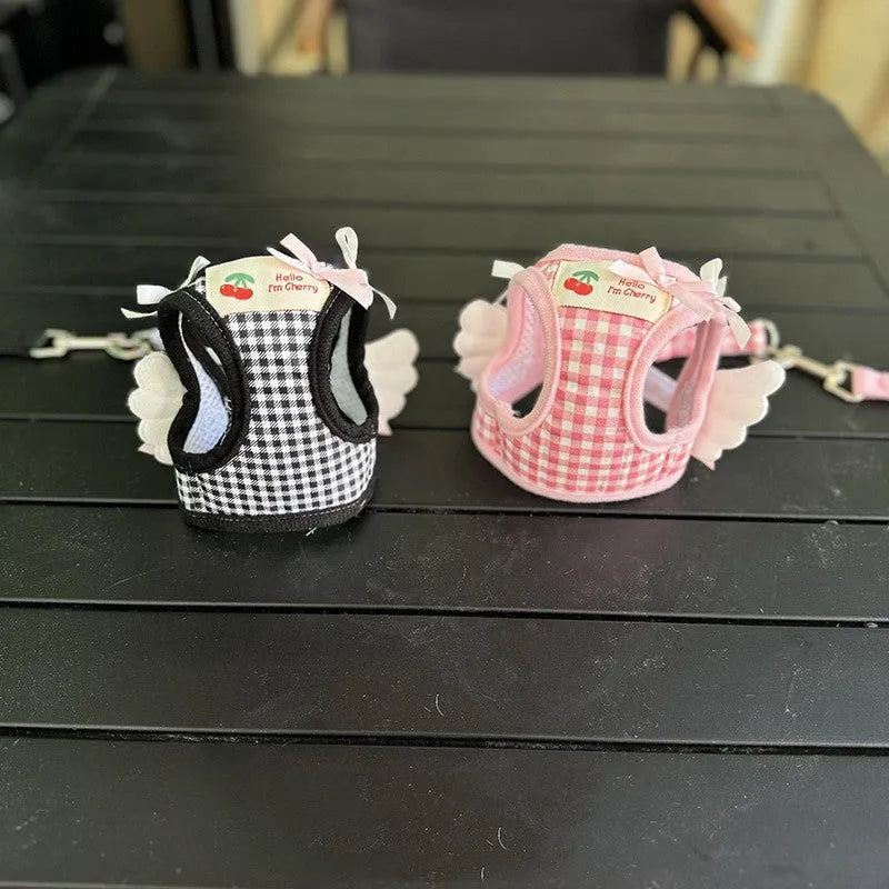 Small dog wearing pink cotton harness with chest and back leash attachment points