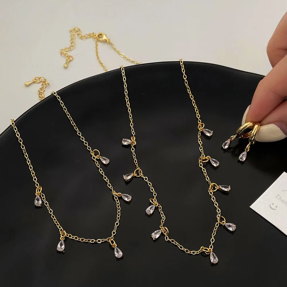Women's zircon jewellery set with necklace, earrings, and anklet featuring geometric meteor shower design