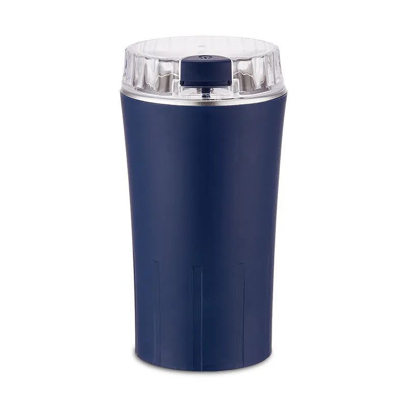 Blue mini flour mill and grinder machine with stainless steel chamber for making spice powder.