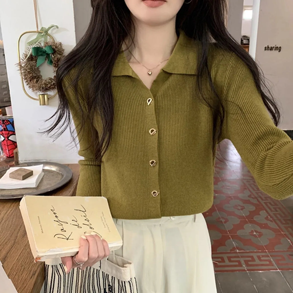 Long sleeve knitted cardigan in viscose fibre showing loose fit and available in beige, black, oatmeal, green, and khaki colours