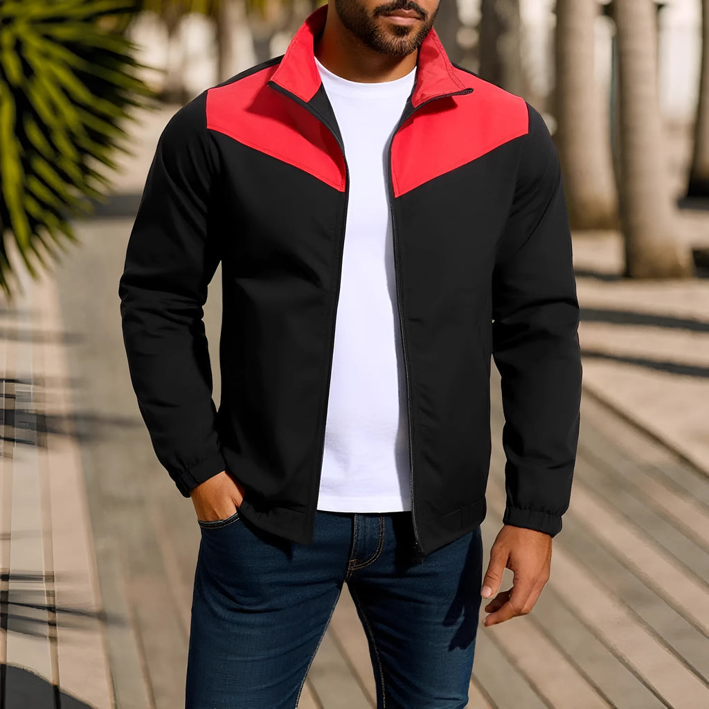 Men's green windproof jacket with high collar and zip front, featuring raglan sleeves.