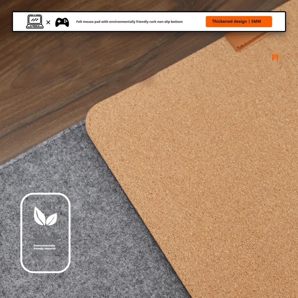 Oversized winter warm desk mat with felt and cork construction on wooden desk