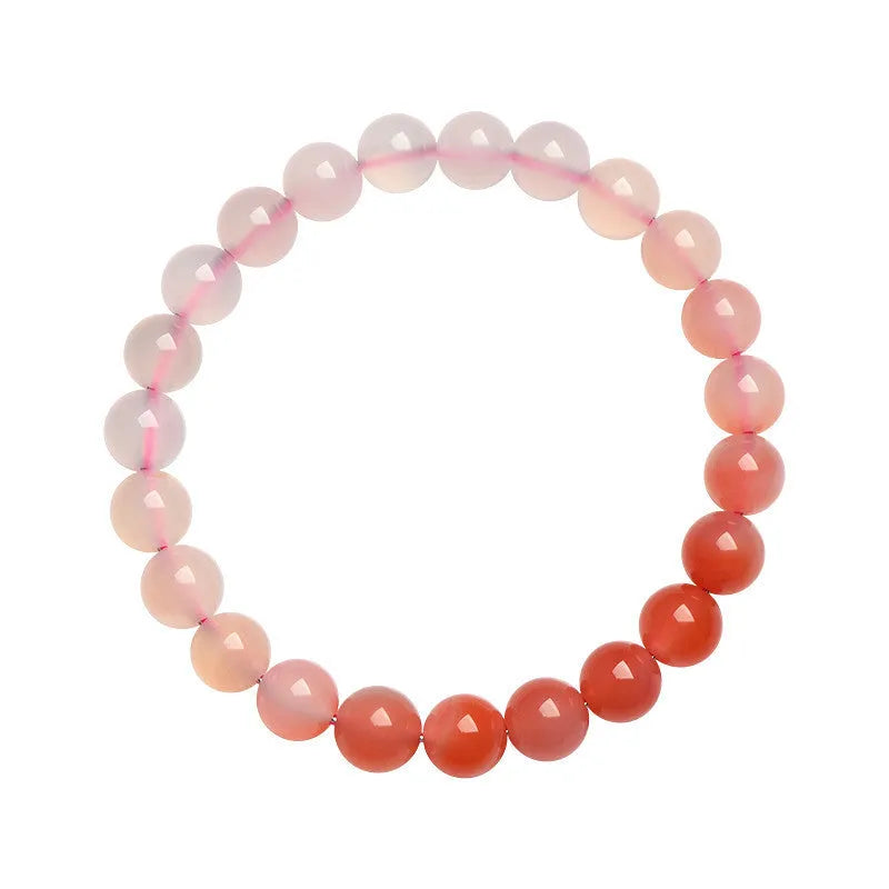 A gradient coloured Yanyuan agate bracelet with polished geometry-shaped beads on a white background.