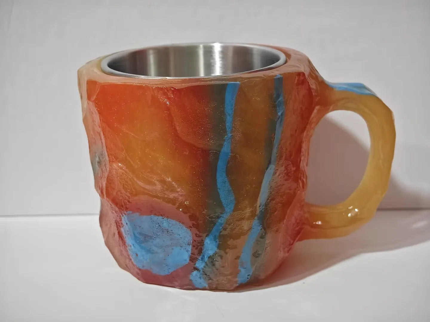 Purple resin mineral crystal coffee mug with handle showing 3D texture and 10cm height