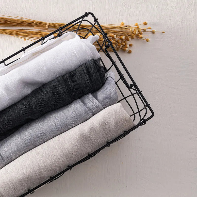 Men's linen straight leg trousers in mid waist design showing white, khaki, light grey and dark grey colour options