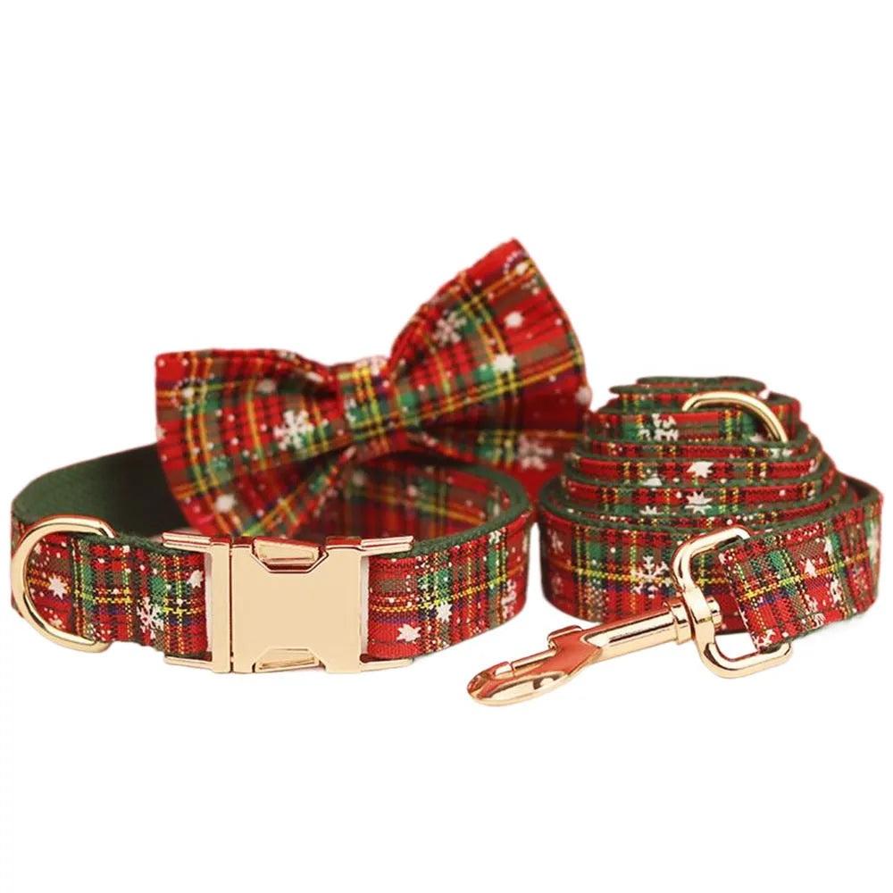 Green snowflake print dog collar set with matching leash, vest, and bow for Christmas