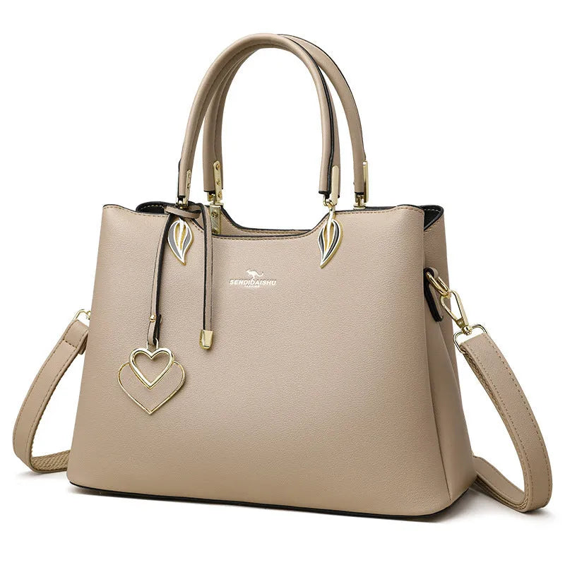 Women's black PU leather shoulder messenger bag with visible stitching and multi-layer interior.