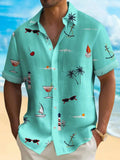 Man wearing a colourful loose-fit Hawaiian print short sleeve shirt on a beach.