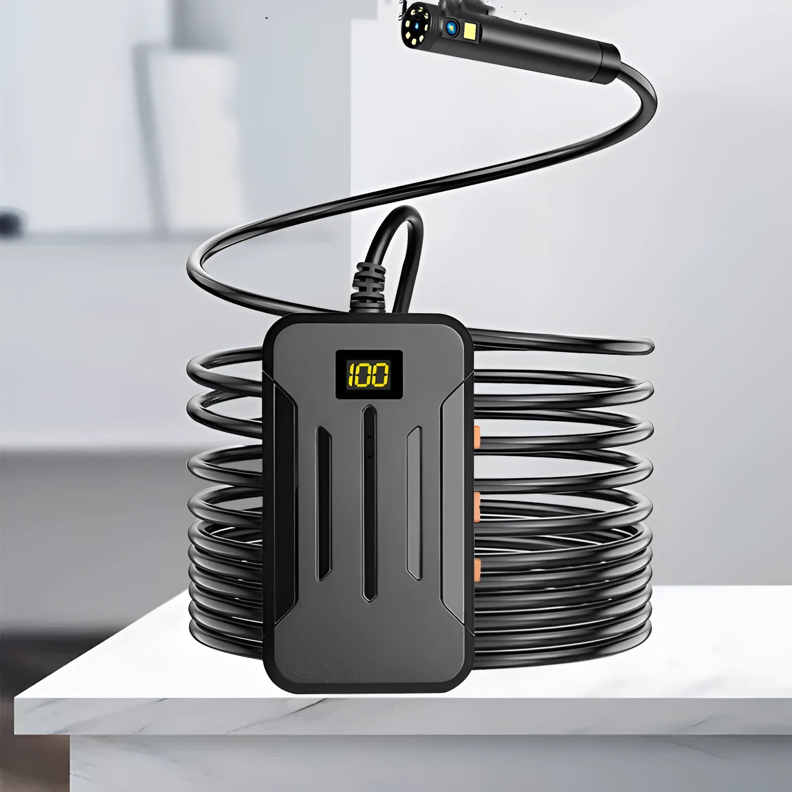 F300 wireless endoscope with dual camera probes, hook, magnet, and charging cable on a grey background.