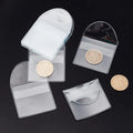 Transparent PVC soft badge bag 0.2mm thick holding coins on a flat surface