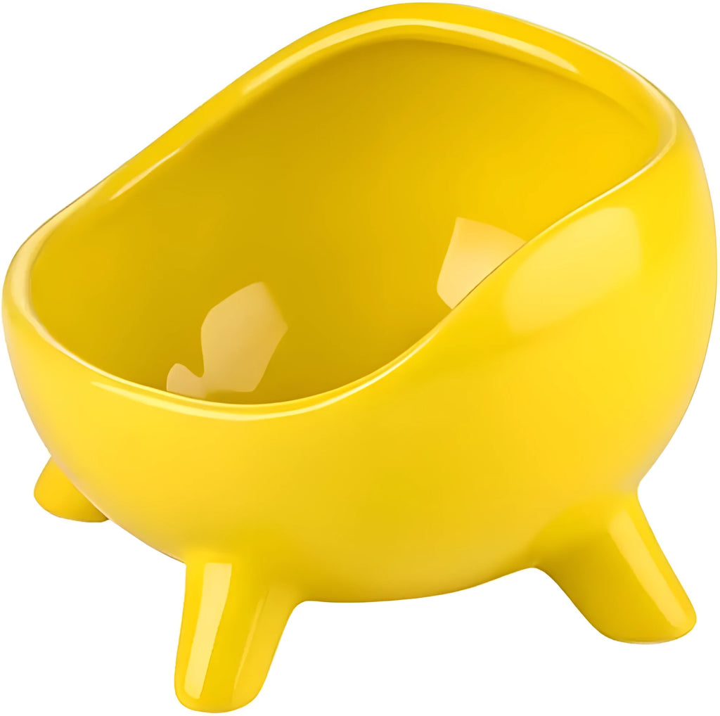 Green ceramic pet bowl with four legs and a rounded rim for stability and spill control.