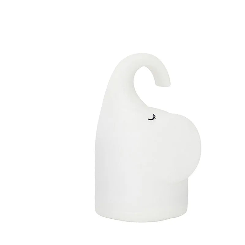 DOMI Elephant-shaped silicone and plastic night light with warm white glow.