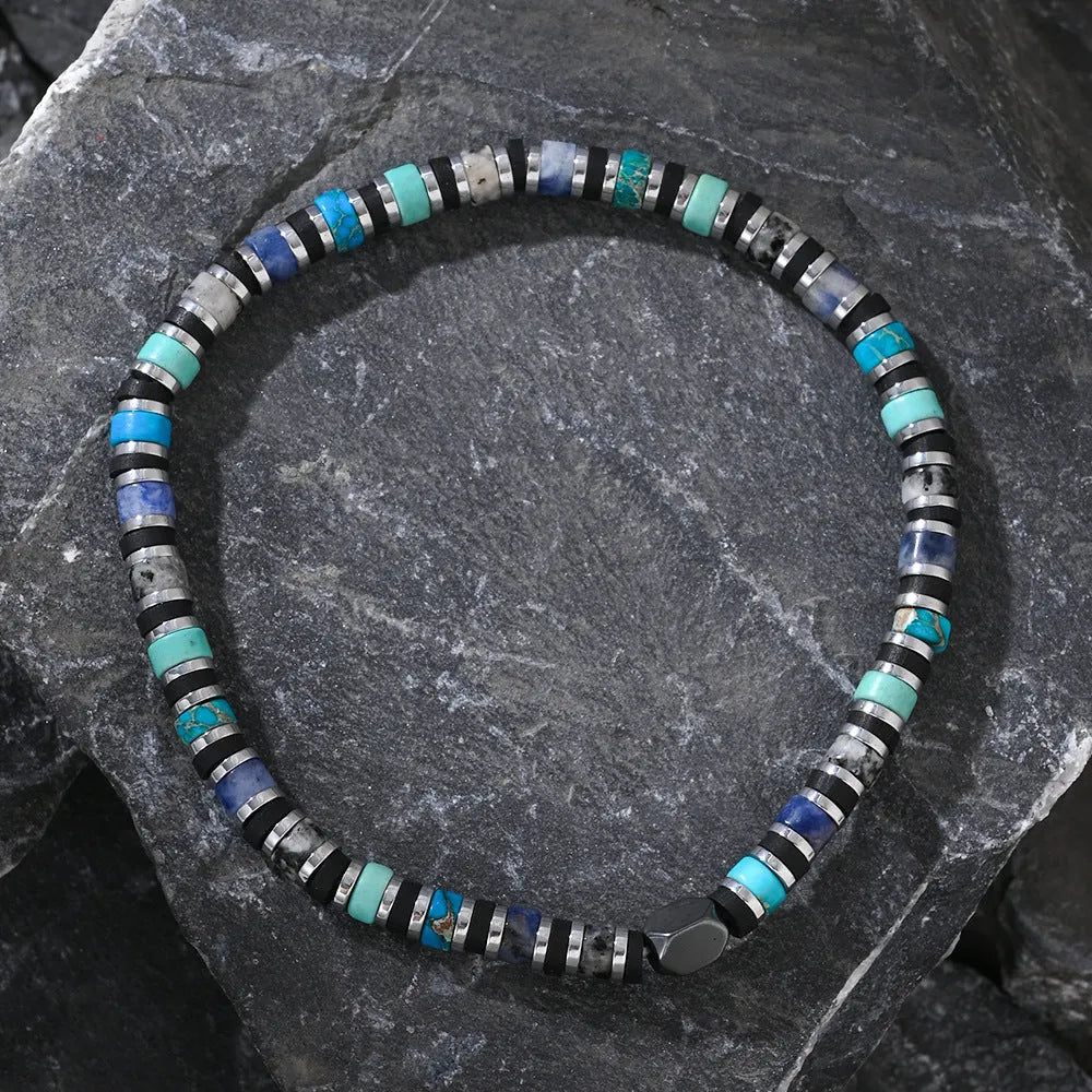 Hand-woven bohemian bracelet with cylindrical semi-precious stone beads in geometric arrangement