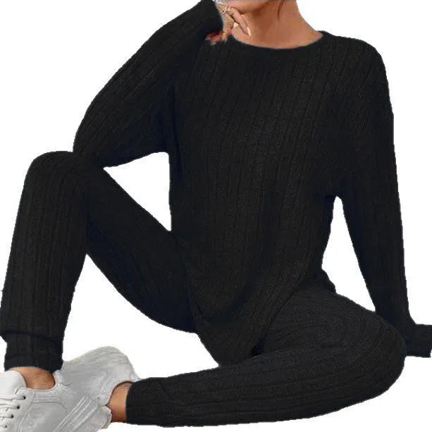 Women's black sunken stripe casual two-piece homewear set with short sleeve top and trousers.