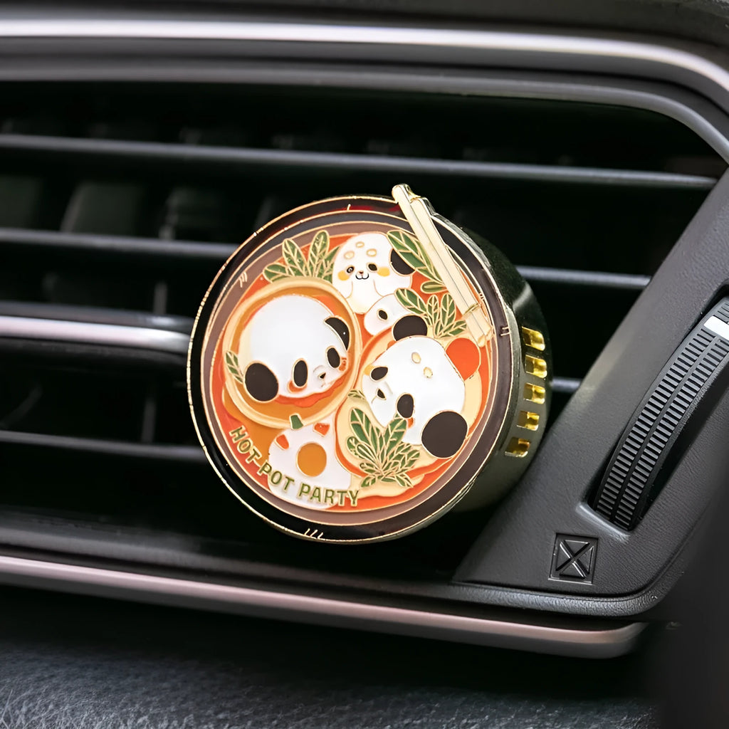 Panda hot pot shaped car air vent fragrance clip on a car vent with diatomaceous earth scent tablets.