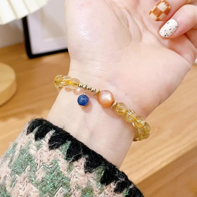 Gold rutilated quartz sunstone crystal bracelet with round diamond-shaped beads