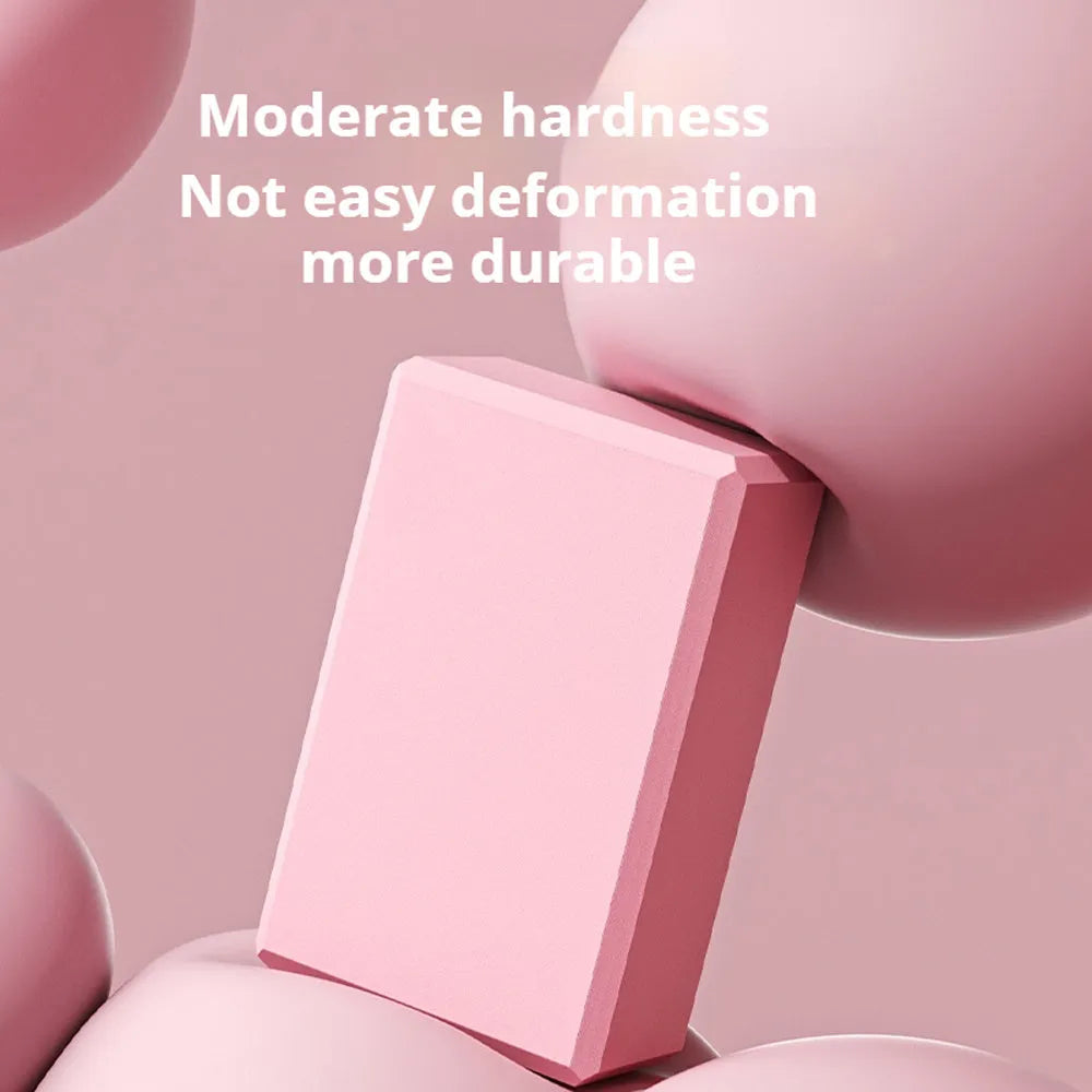 High-density EVA foam yoga block measuring 23x15x7.6cm with twelve grip ridges in solid colour