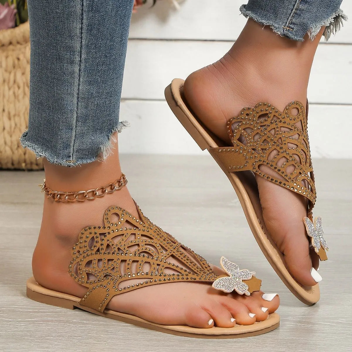 Women's black flip-toe sandals with rhinestone decoration showing slip-on hollow design