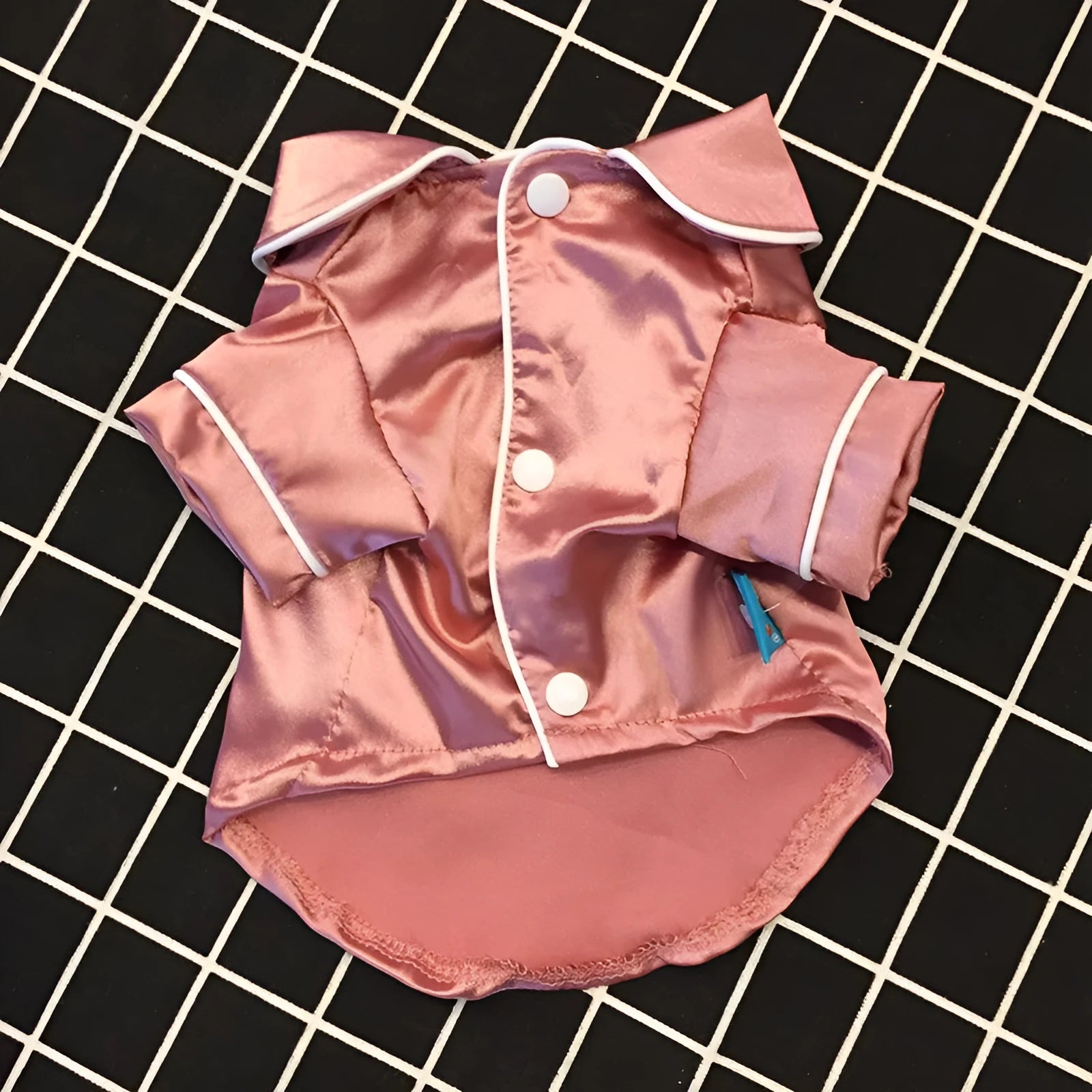 Fashion Personality Teddy Dog Clothing in pink pajamas style for a small dog, made from polyester, on a plain background