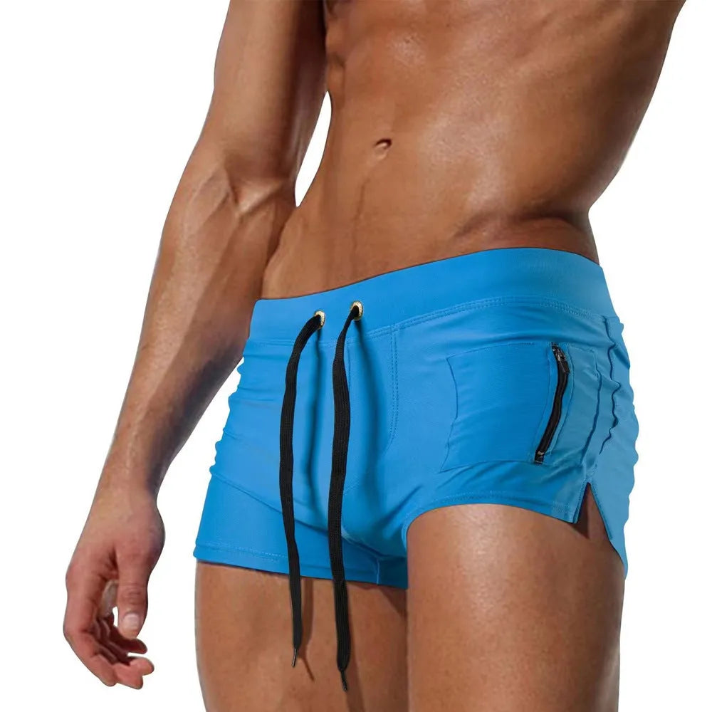 Men's black polyester swimming trunks with high-waist design and lace-up closure