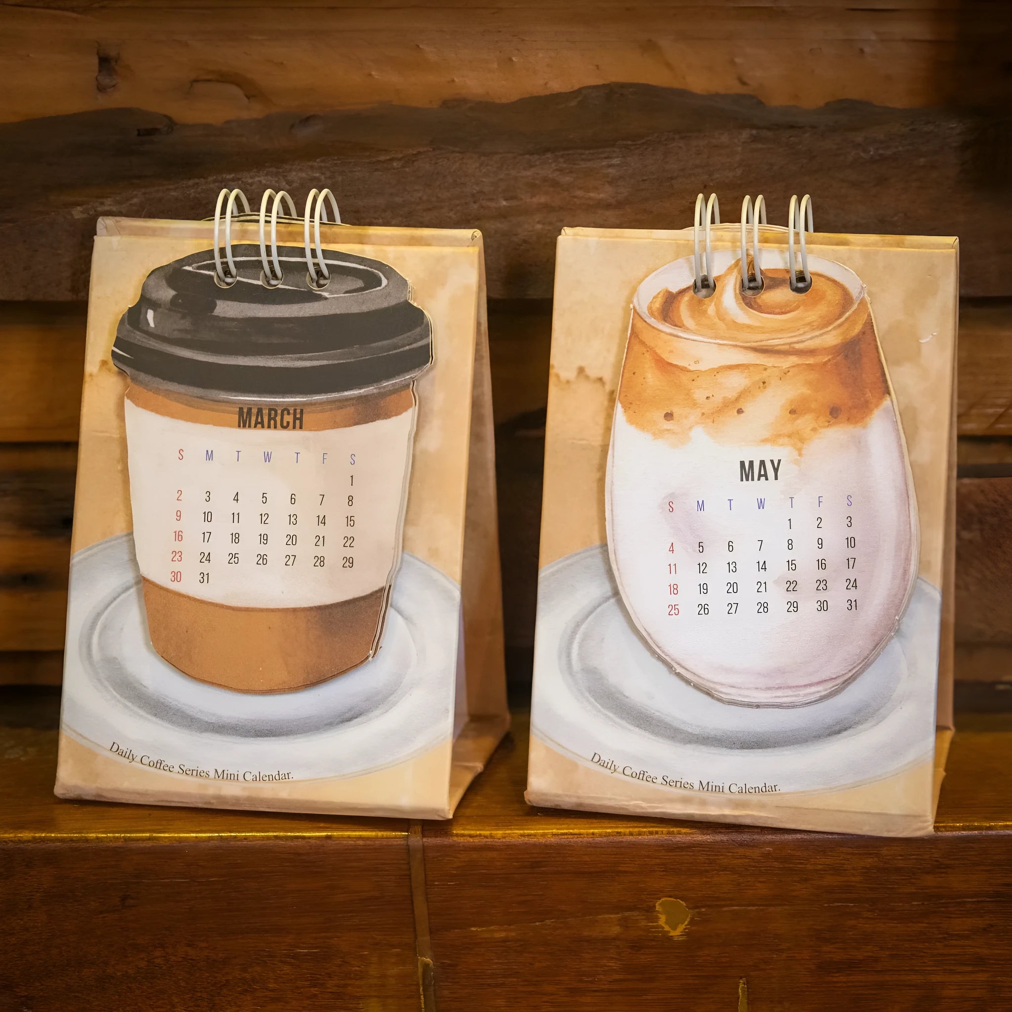Coffee Coffee mini desk calendar set showing four 2025 paper calendars with different themes for daily inspiration