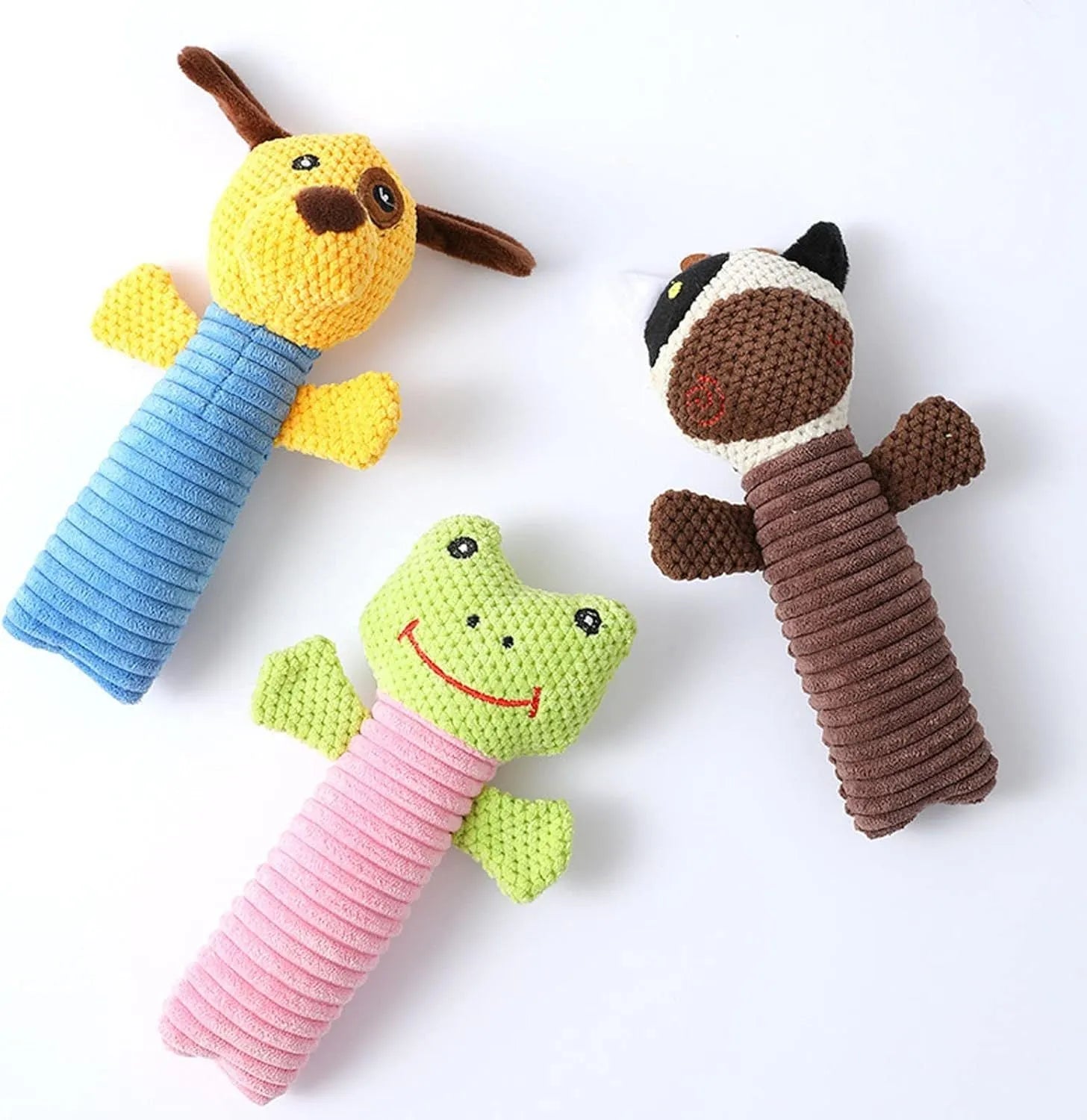 Squeaky stuffed dog chew toy in calf, frog, or puppy shape on white background