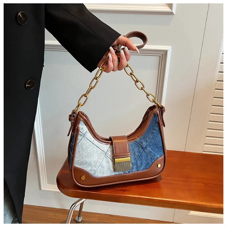 Brown denim women's bucket shoulder bag with diamond mesh, chain detail, and double straps.