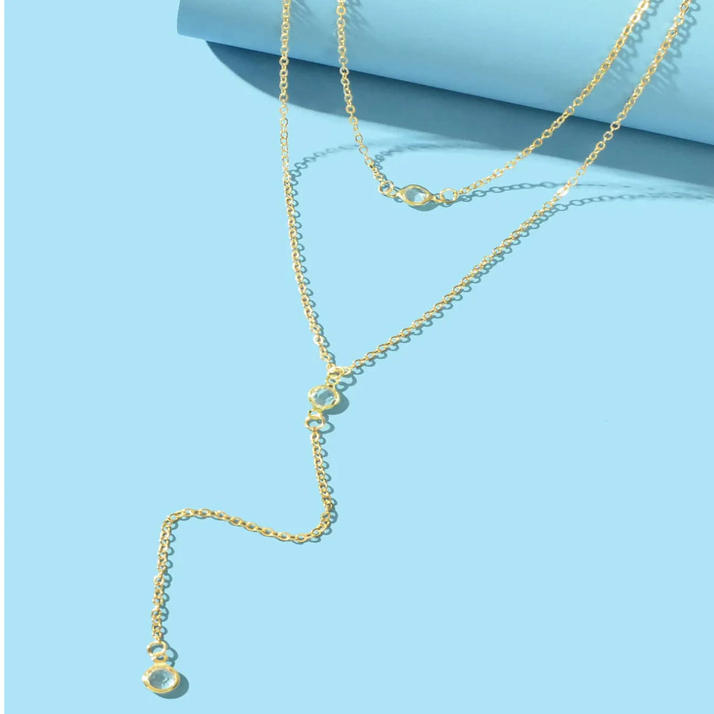 Alloy geometric pendant necklace with electroplated gold finish and O-ring chain on woman