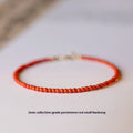 Close-up of a women's retro bracelet with Southern Red agate beads showing 3mm cut surface, in cherry red colour on a wrist.
