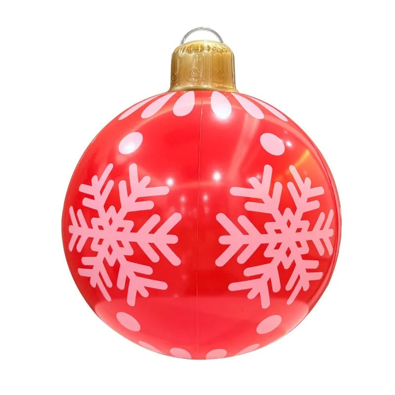 63cm red inflatable Christmas ball with LED lights in outdoor garden setting