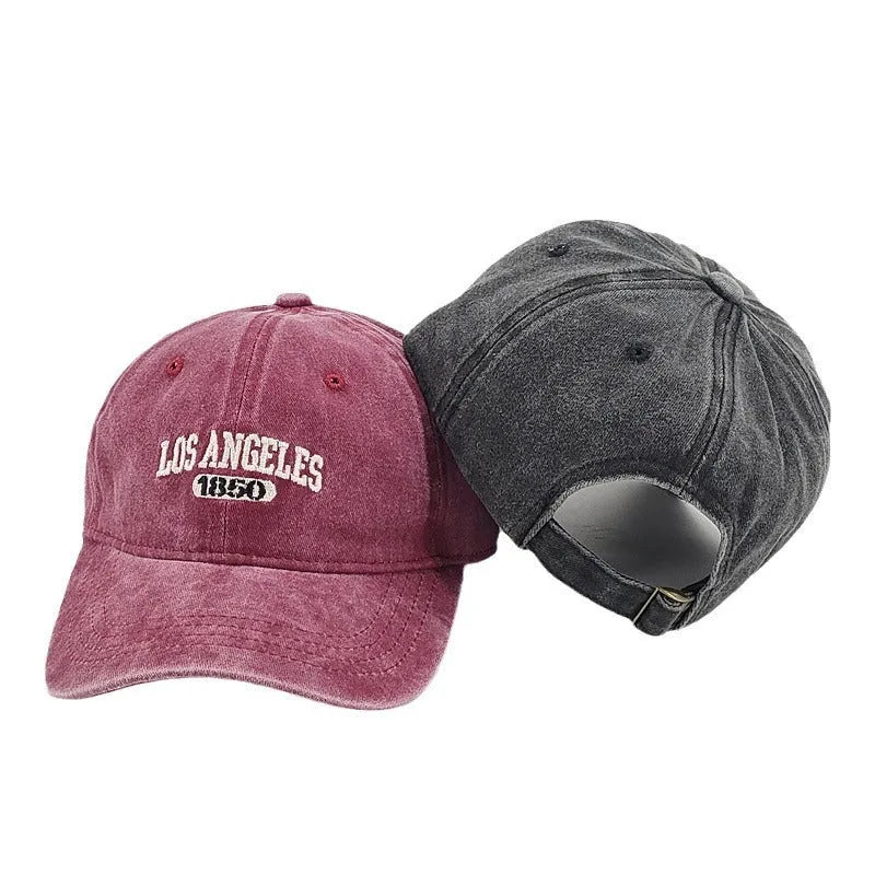 Retro personalised peaked cap with embroidered letters on washed distressed fabric