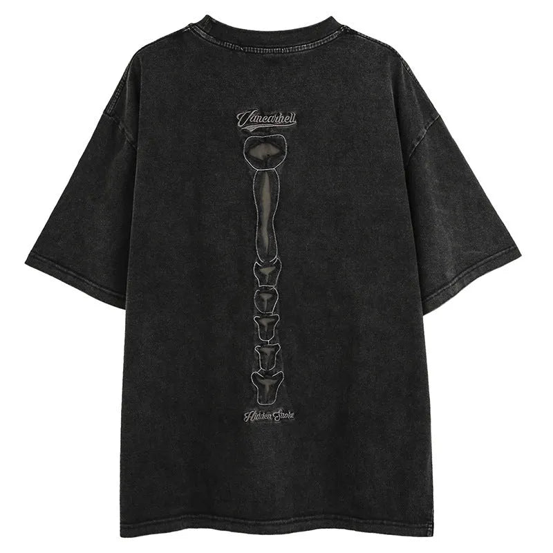 Brown loose-fit men's t-shirt with a skull and letter graphic print and drop-shoulder sleeves.