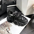 Women's wedge platform sneakers in creamy white with cross-strap detail and lace-up front