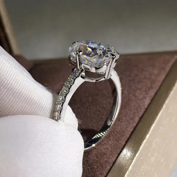 Women's moissanite four-prong princess cut ring in white gold colour on copper band, size no.7