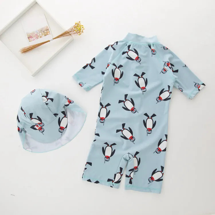 Boys' blue penguin print swim set with long sleeve swimsuit and matching swimming cap