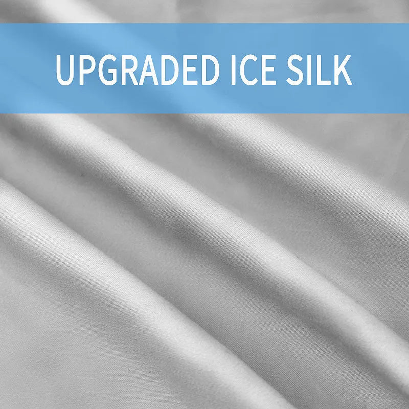 U-shaped pregnancy pillow in light blue ice silk fabric on a bed.
