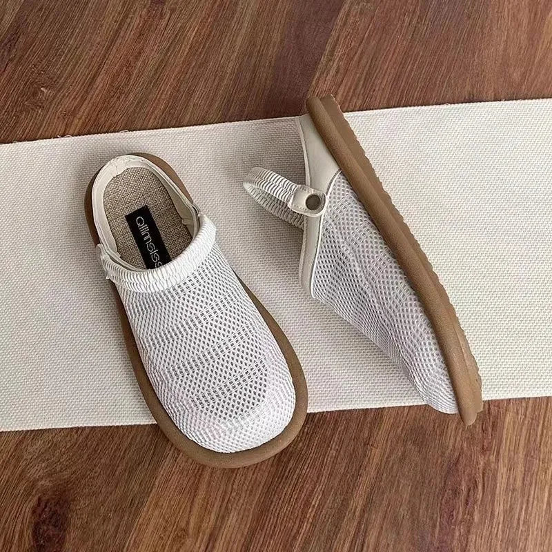 Milky white slip-on shoes with a hollow patterned linen upper and mesh lining, shown on a foot.