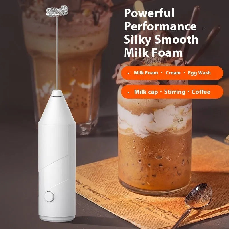 Mini handheld electric milk frother in black, white, or khaki with stainless steel whisk and USB charging port.