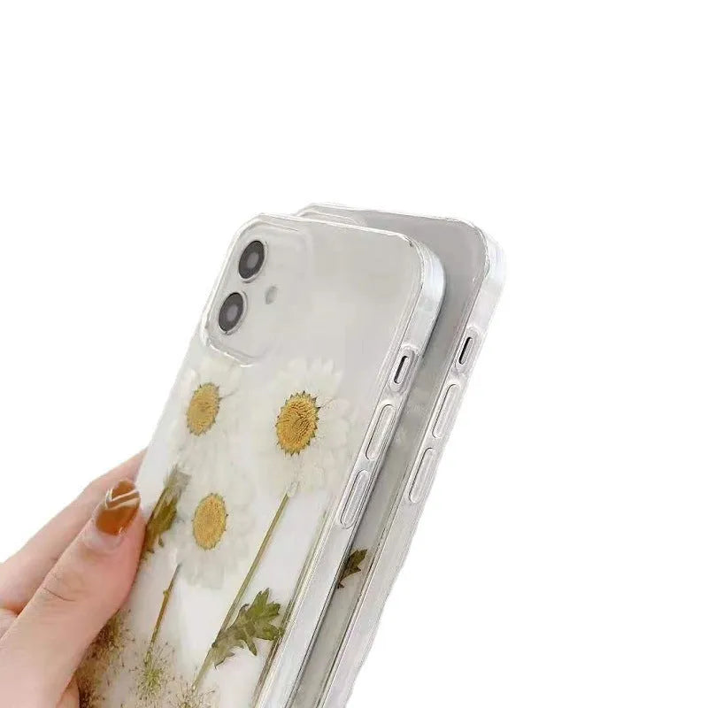 White TPU iPhone case with a raised epoxy daisy flower design on the back
