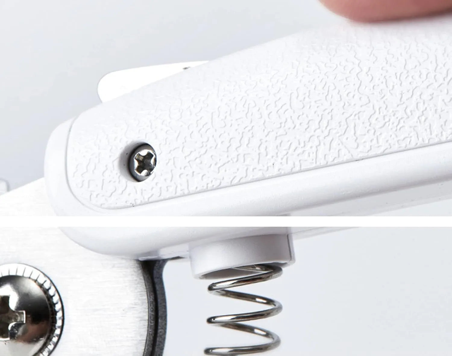 White pet nail clippers with LED light on blade and transparent anti-splash guard, shown with a nail file.