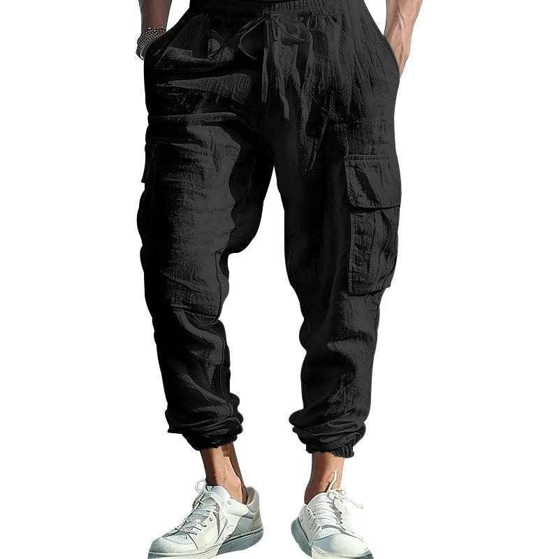 Men's ankle-tied linen trousers in Army Green colour showing multi-pocket design and drawstring waist