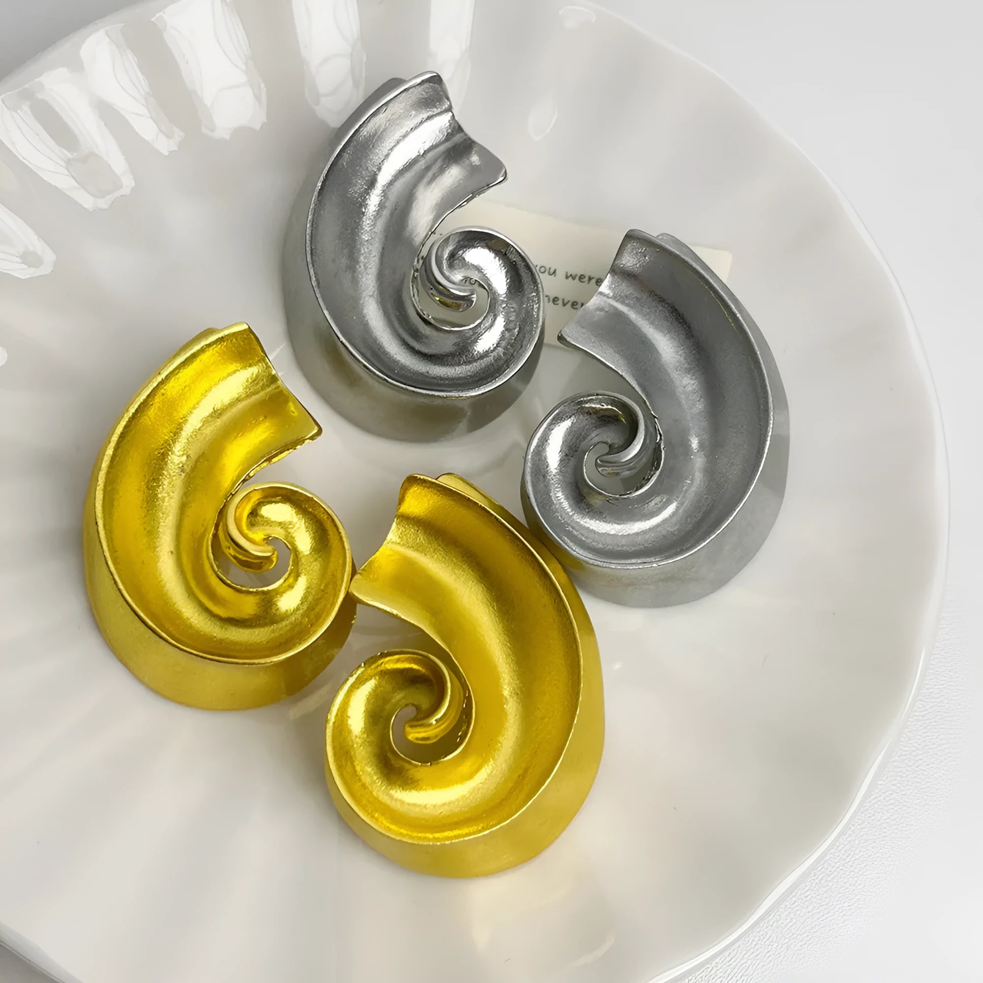 A pair of gold geometric retro-design ear studs for women, measuring 5cm.