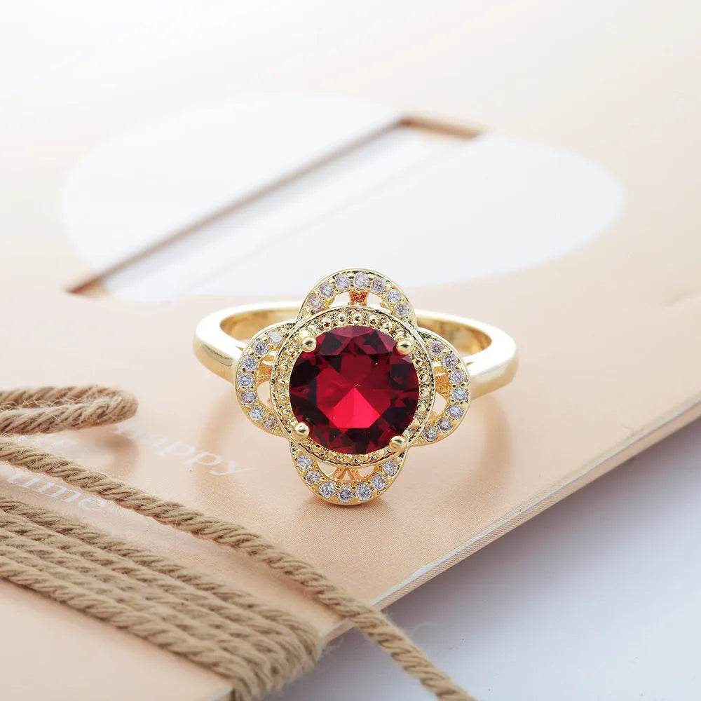 Copper fruit-shaped ring with inlaid zircon stone, shown in colour 10-6-1395.