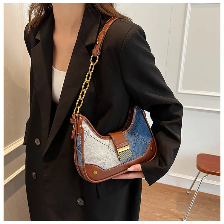 Brown denim women's bucket shoulder bag with diamond mesh, chain detail, and double straps.